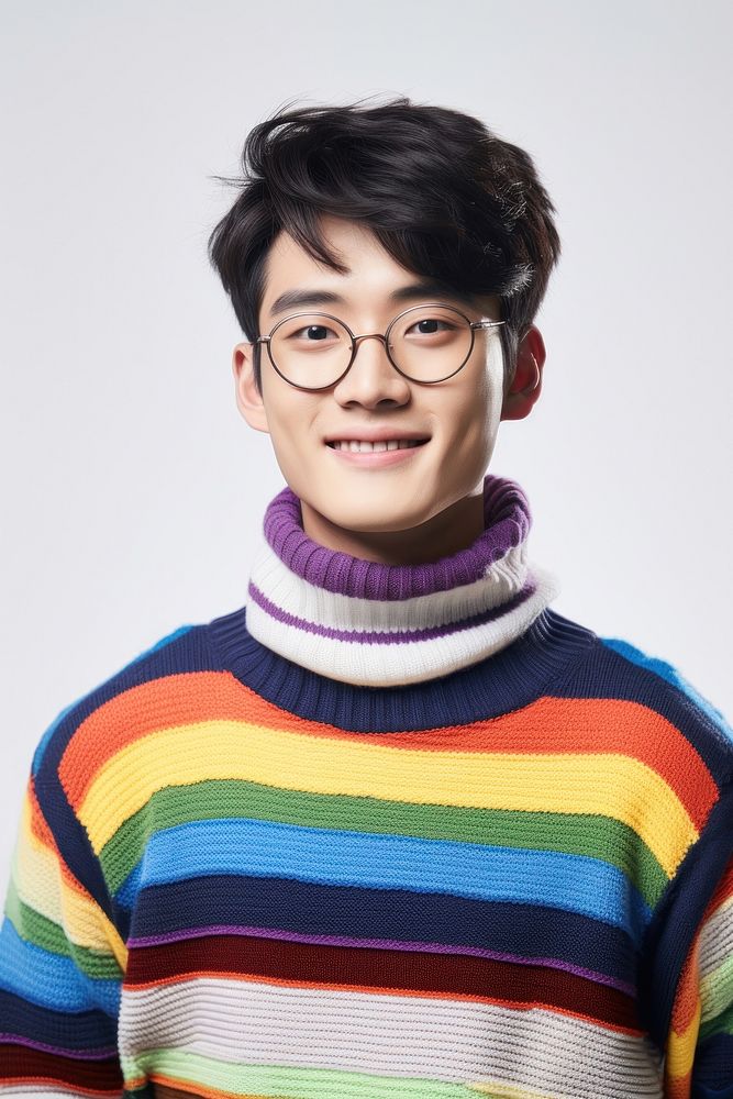 Young Chinese man turn to face wearing colorful sweater glasses fashion white background. AI generated Image by rawpixel.