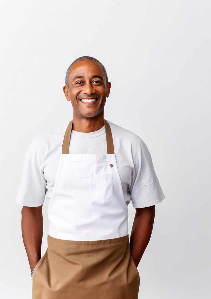 A multiracial man wearing white linen shirt with a brown apron smiling adult smile. AI generated Image by rawpixel.