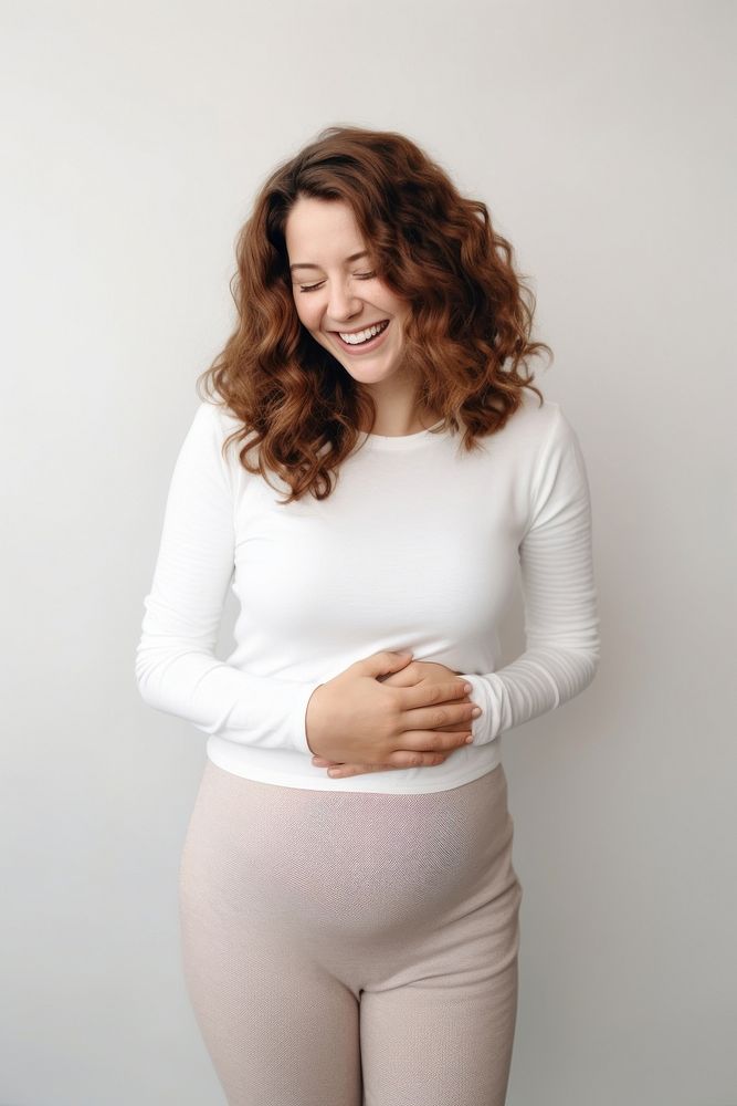 Happy Woman Touching Her Belly portrait sleeve adult. AI generated Image by rawpixel.