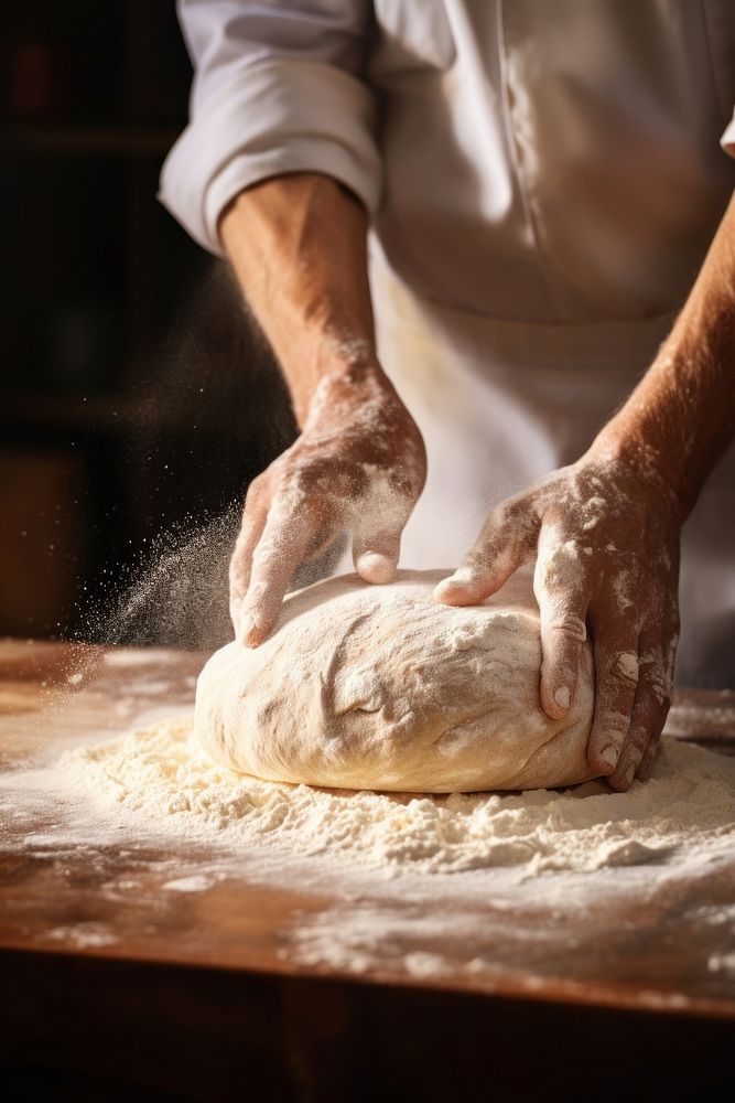 Kneading bread dough cooking kitchen adult. AI generated Image by rawpixel.
