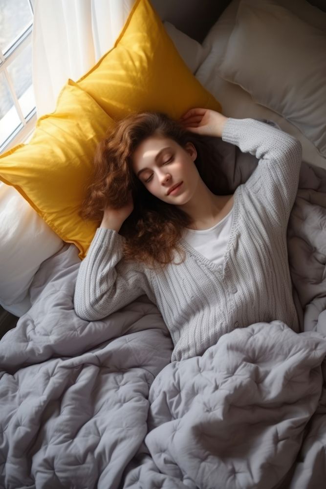 Woman lying in bed comfortable sleeping blanket. AI generated Image by rawpixel.