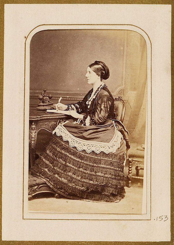 Portrait of a woman writing by Henry Maull and Co