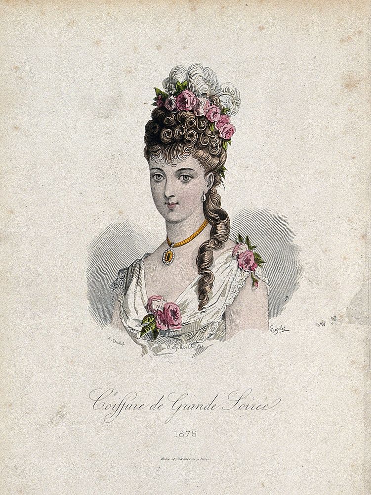The head and shoulders of a woman with brown hair wearing a high chignon attached to her natural hair which is decorated…