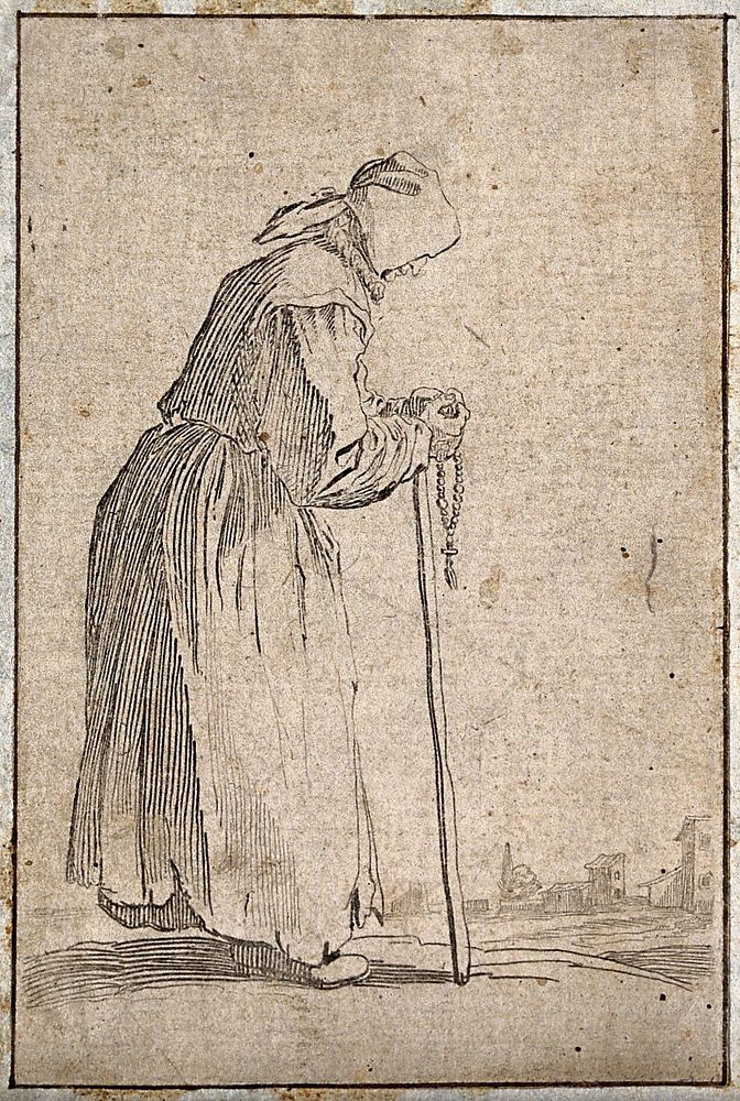 An old woman dressed in rags holding a rosary in her right hand and a staff in her left. Etching possibly after J. Callot.