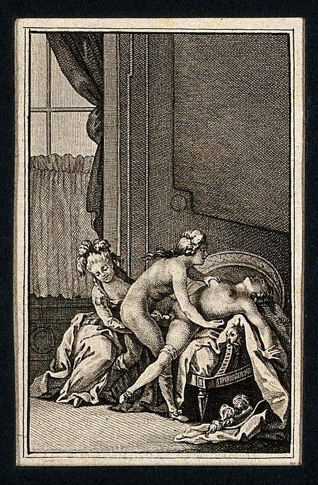 A man and two women engaged in sexual intercourse leaning against a neoclassical armchair; window in the background.…