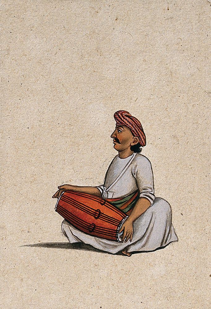 A musician playing the dholak (double sided drum). Gouache painting by an Indian artist.