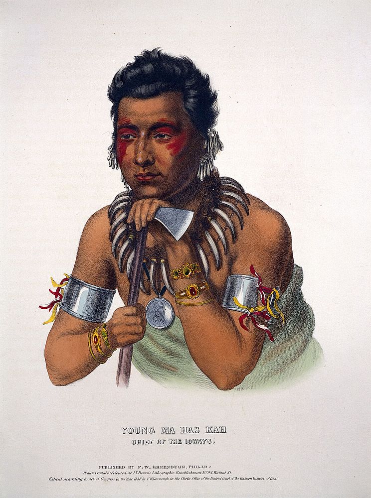Ma-hos-kah (White Cloud) the Younger, a chief of the Iowa tribe, leaning on a tomahawk. Coloured lithograph by J.T. Bowen…