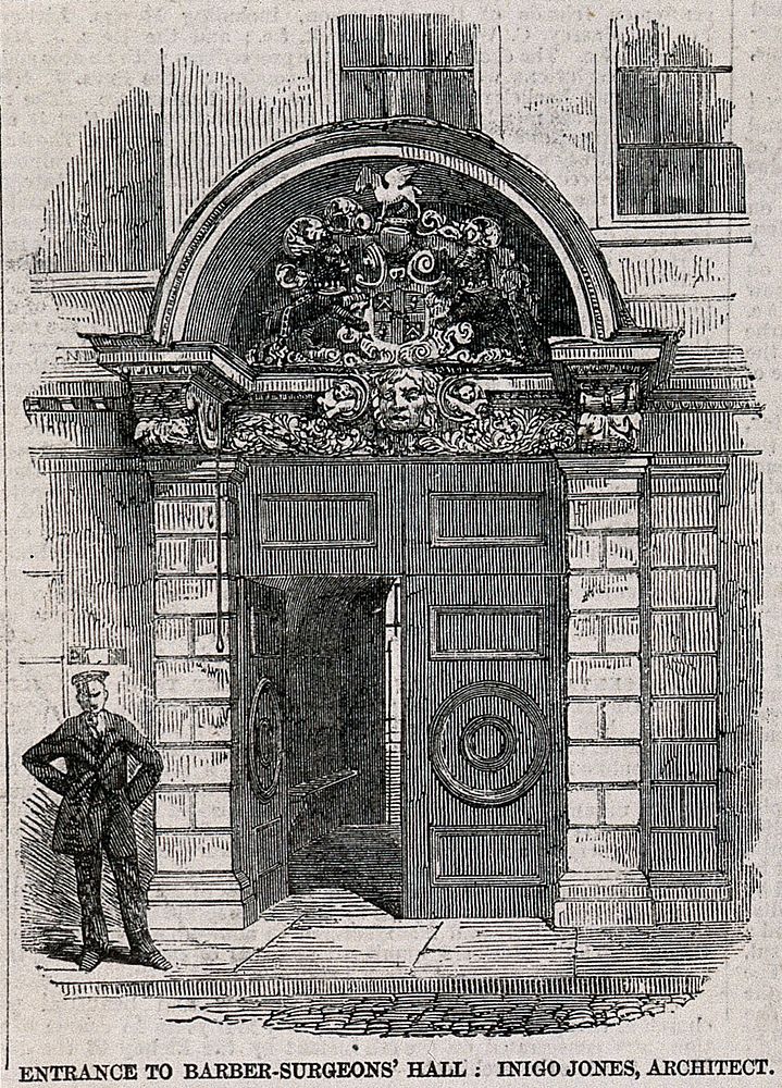 Barber-surgeons' Hall, Monkwell Street, London: the door of the hall, with a uniformed attendant standing to the left. Wood…