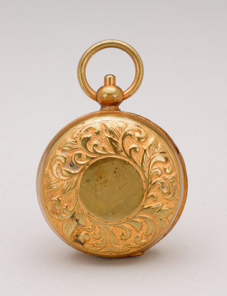 round, gold pocket watch; leaf motif around edges of cover; inside coin holder has head of a man. Original from the…