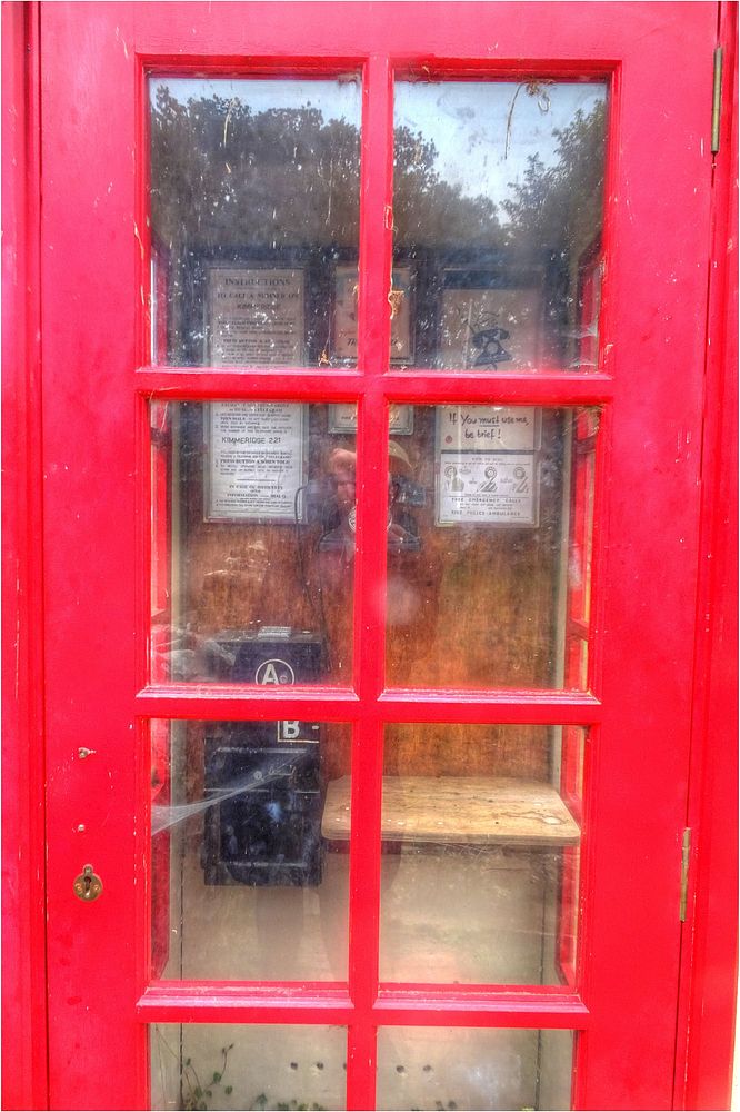 Pay telephone box, retro communication.