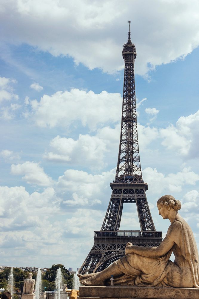 Statue of Waiting Woman on Trocadero with the Eiffel Tower in the background, in Paris, France.
