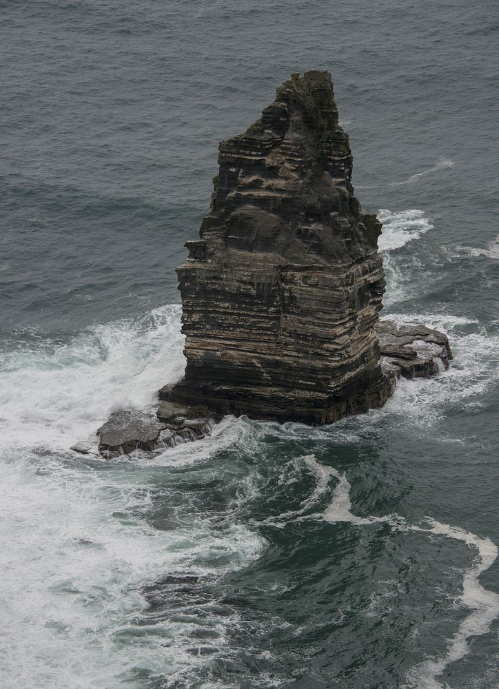 Sea waves crashing into rock. Free public domain CC0 photo.