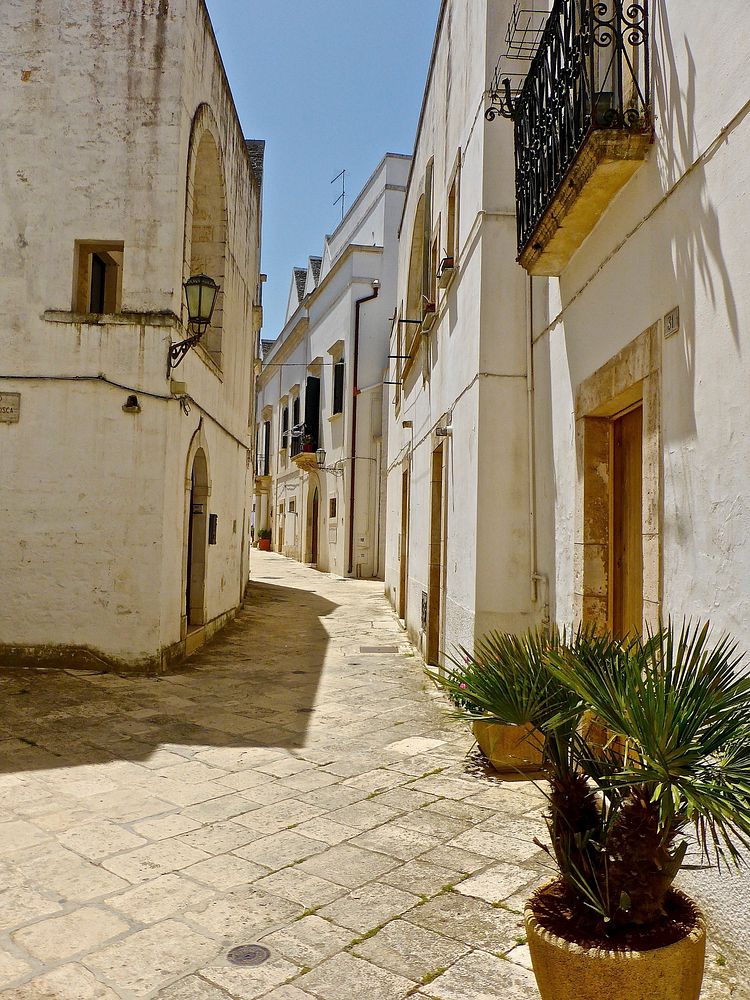 Empty pathway between buildings. Free public domain CC0 image.