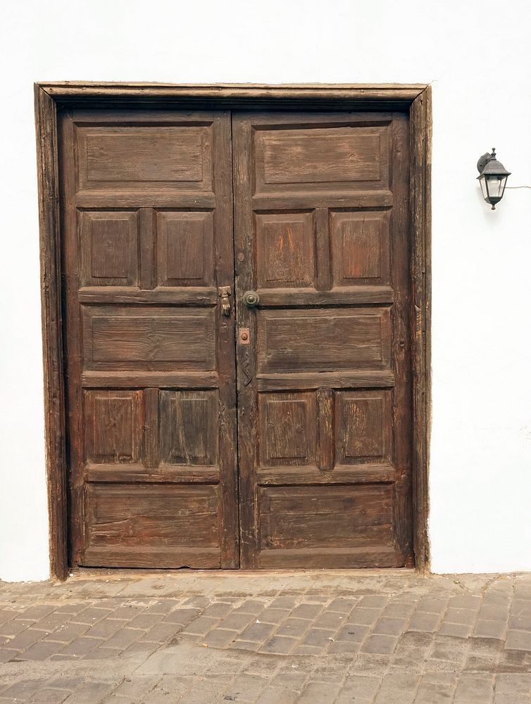 Rustic wooden door on building. Free public domain CC0 photo.