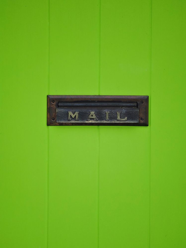 Mailbox on door. Free public domain CC0 photo.