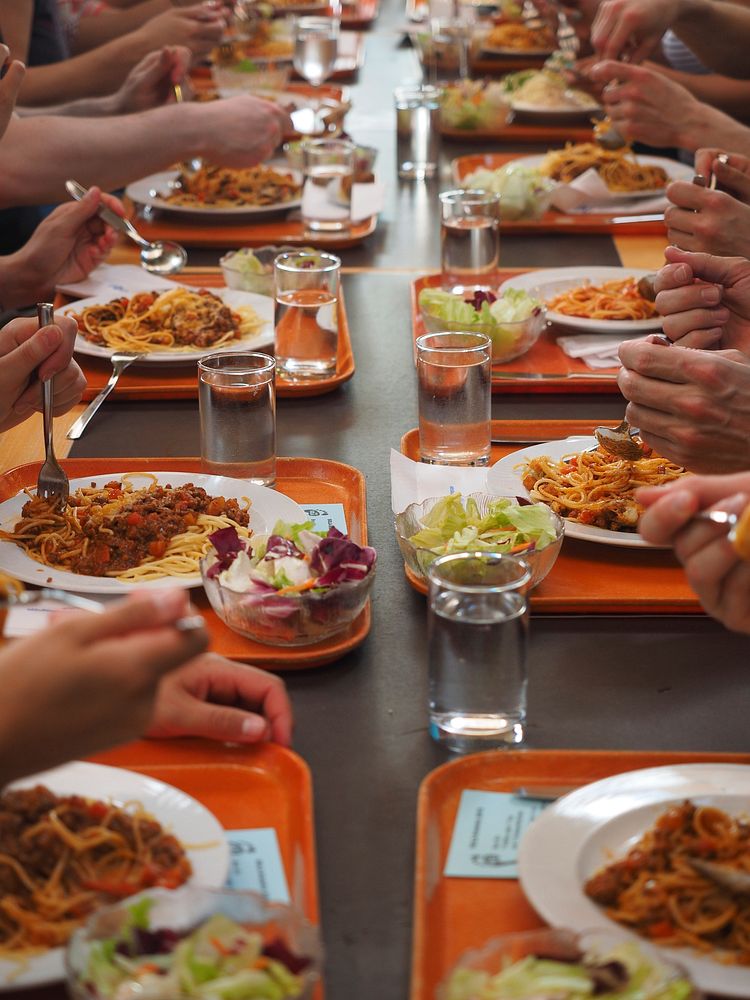 People eating in canteen. Free public domain CC0 photo.