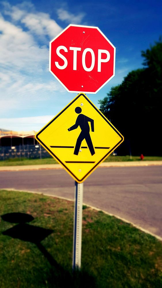 Close up of crosswalk symbol with stop road sign. Free public domain CC0 photo.