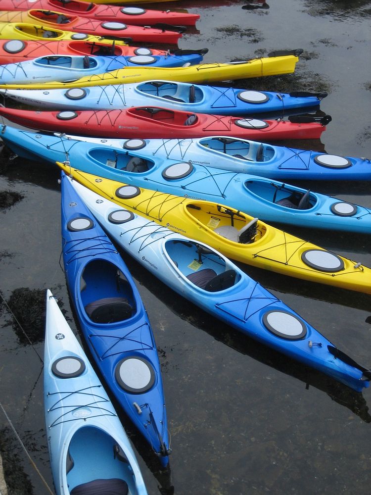 Parked kayak by the water. Free public domain CC0 photo.