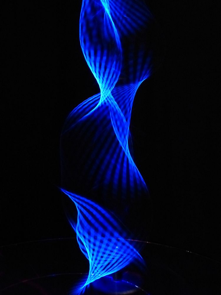 Blue abstract light, black background. Free public domain CC0 photo.