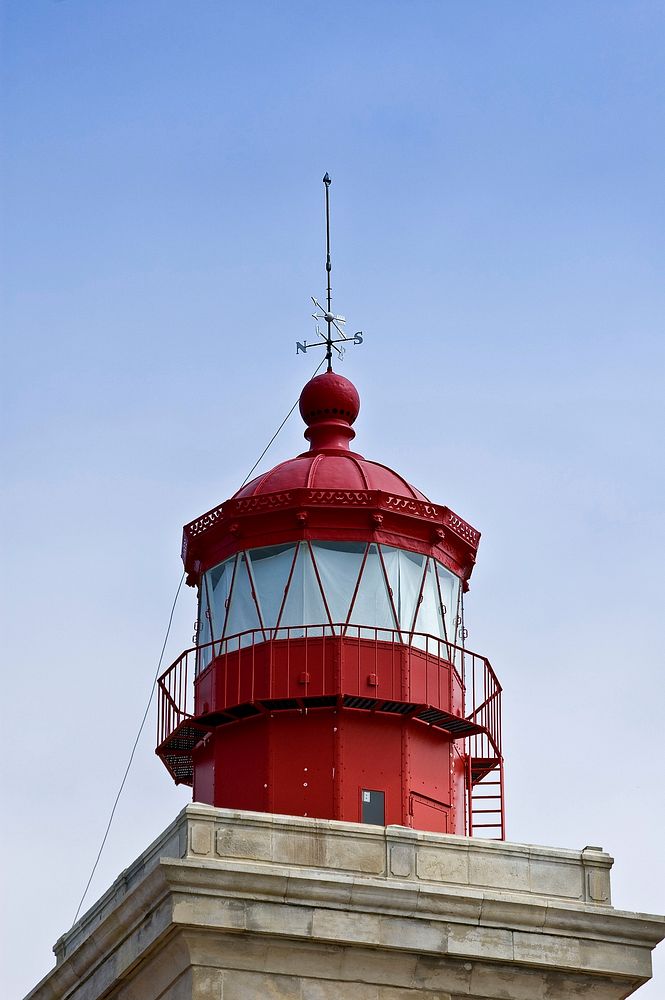 Closeup on a red and white lighthouse. Free public domain CC0 photo.