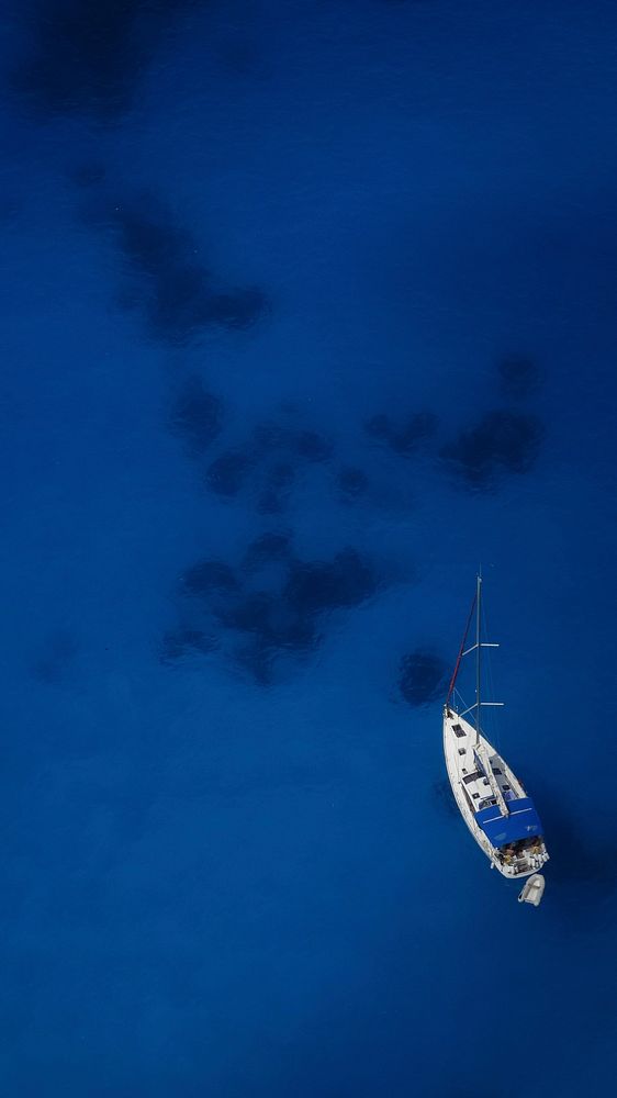 Yacht sailing in the sea. Free public domain CC0 photo.