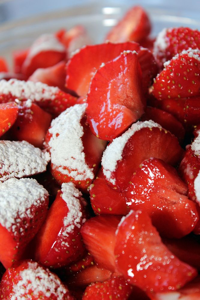 Strawberry with icing sugar. Free public domain CC0 photo.