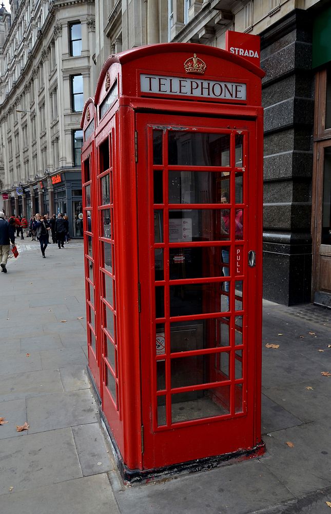 Iconic red phone booth in London, England. Free public domain CC0 photo.