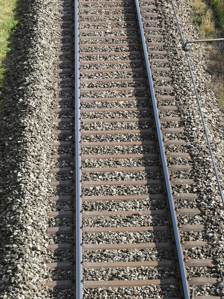 Empty train track. Free public domain CC0 photo.