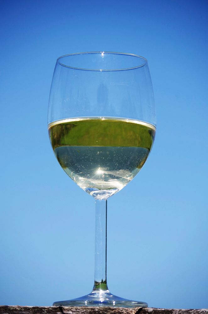 Glass of white wine. Free public domain CC0 photo.