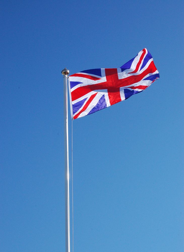 UK flag, blue sky. Free public domain CC0 photo.