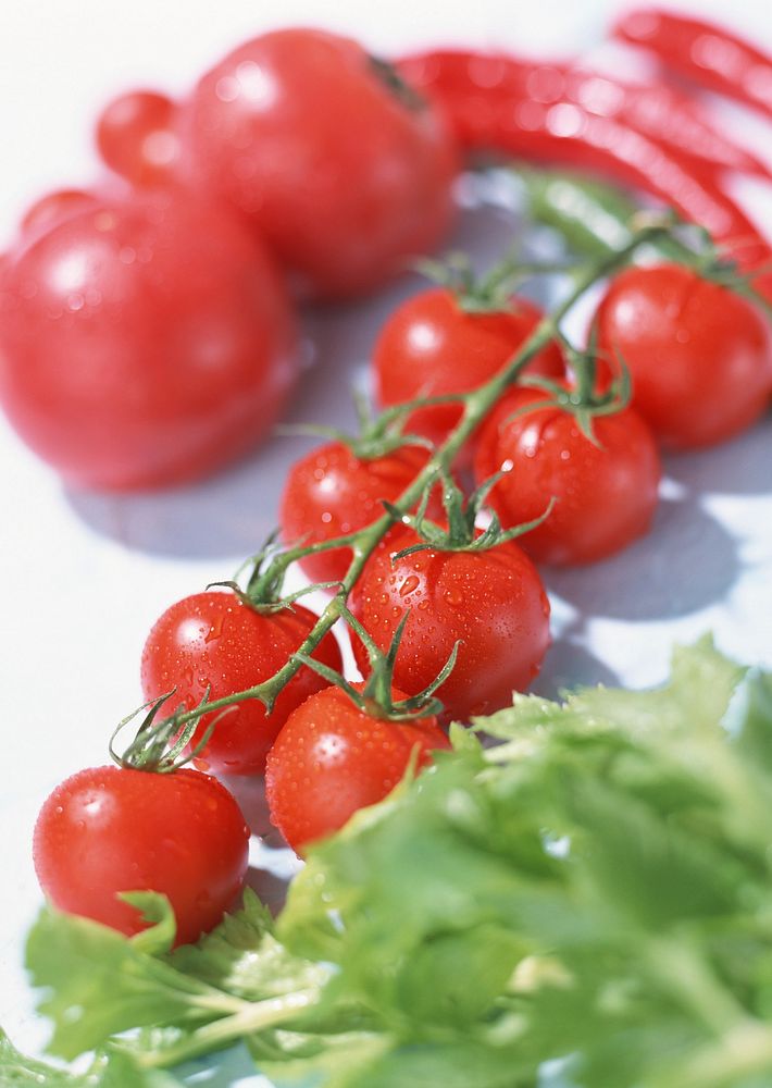 Free cherry tomatoes with stem on white background image, public domain food CC0 photo.