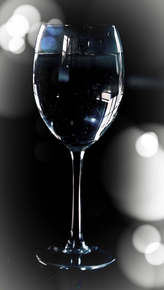 Free wine glass, black background, public domain drink CC0 photo.