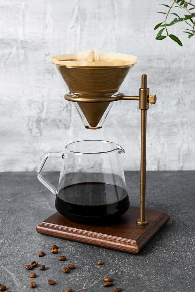 Drip coffee making, pour over coffee maker and grunge wall