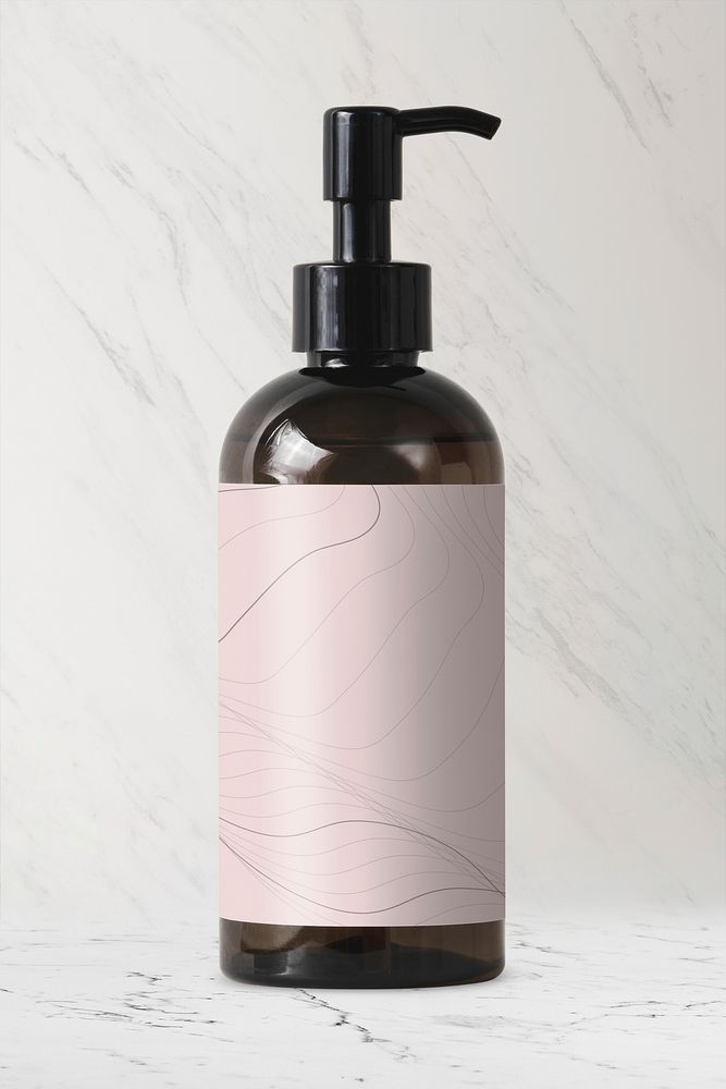 Brown dispenser bottle, abstract pink label, skincare product packaging