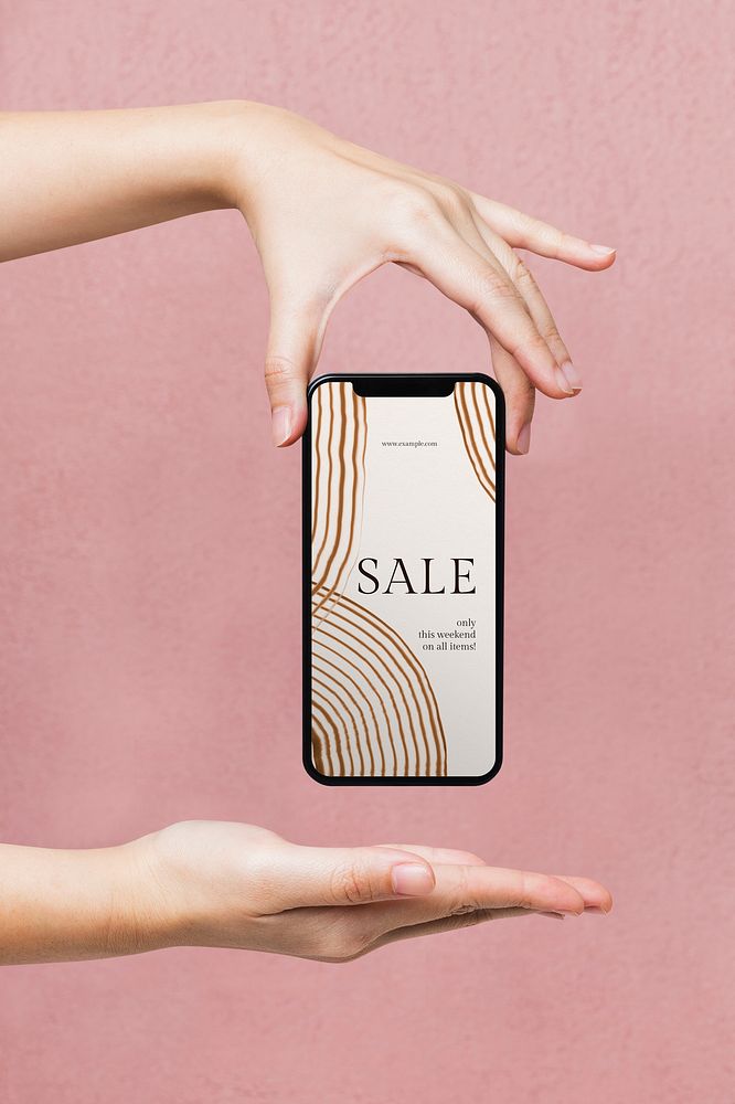 Sale ad in a smartphone screen, woman holding on pink background