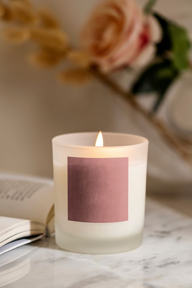 Lit candle, blank pink label, business branding