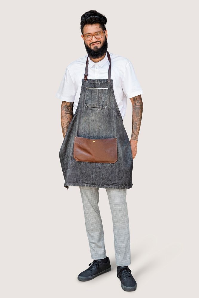 Hipster barber in faded denim apron, full body