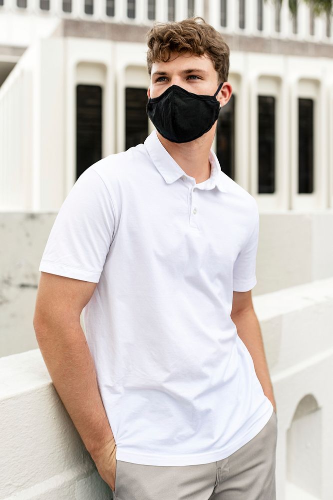 Man wearing face mask in park, the new normal lifestyle