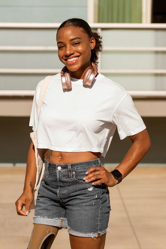 Confident amputee woman wearing white plain shirt, happy summer image 
