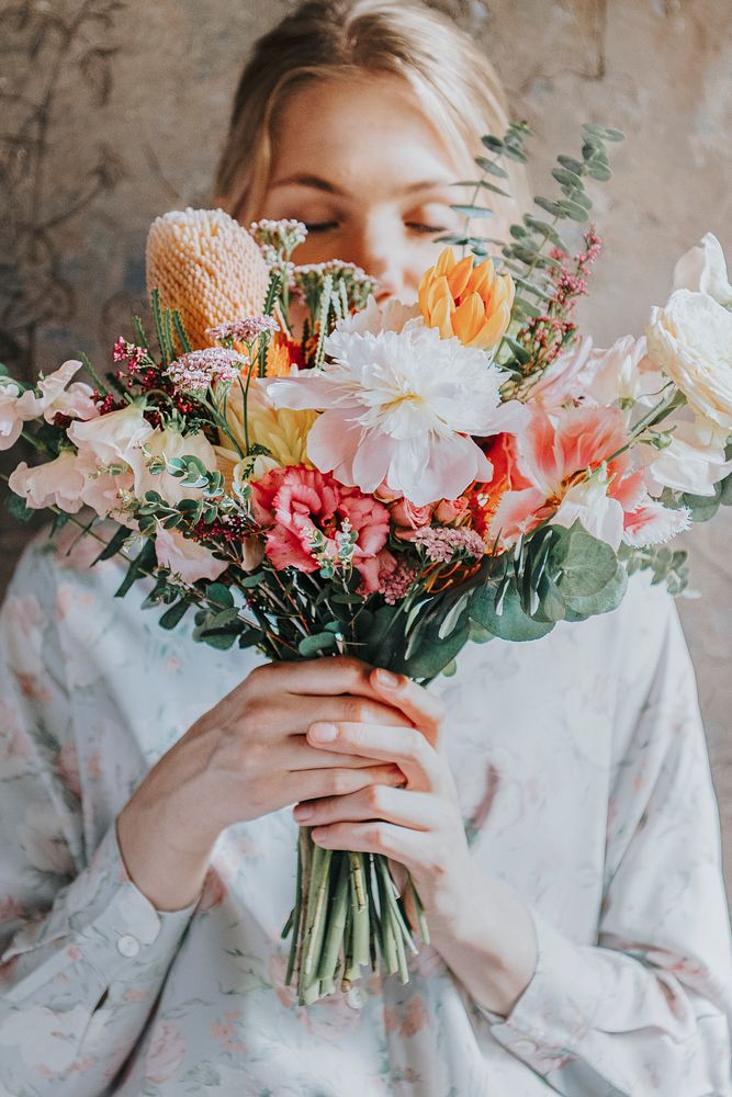 Woman holding a bouquet of flowers