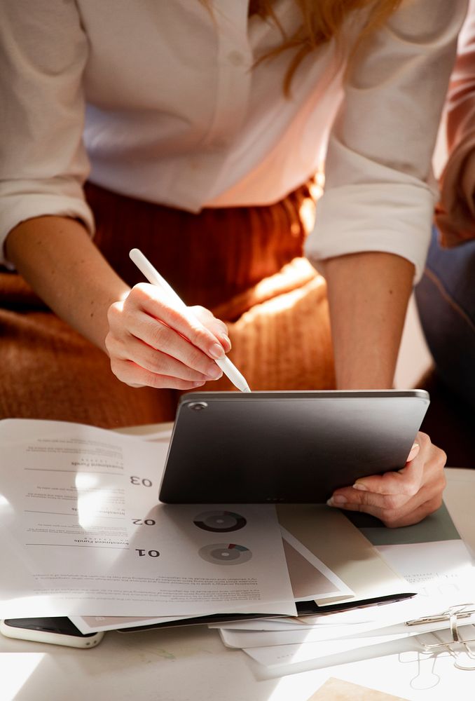 Fashion designer working on a digital tablet