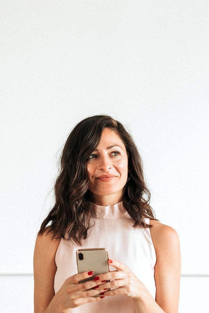 Female using a smartphone in a room