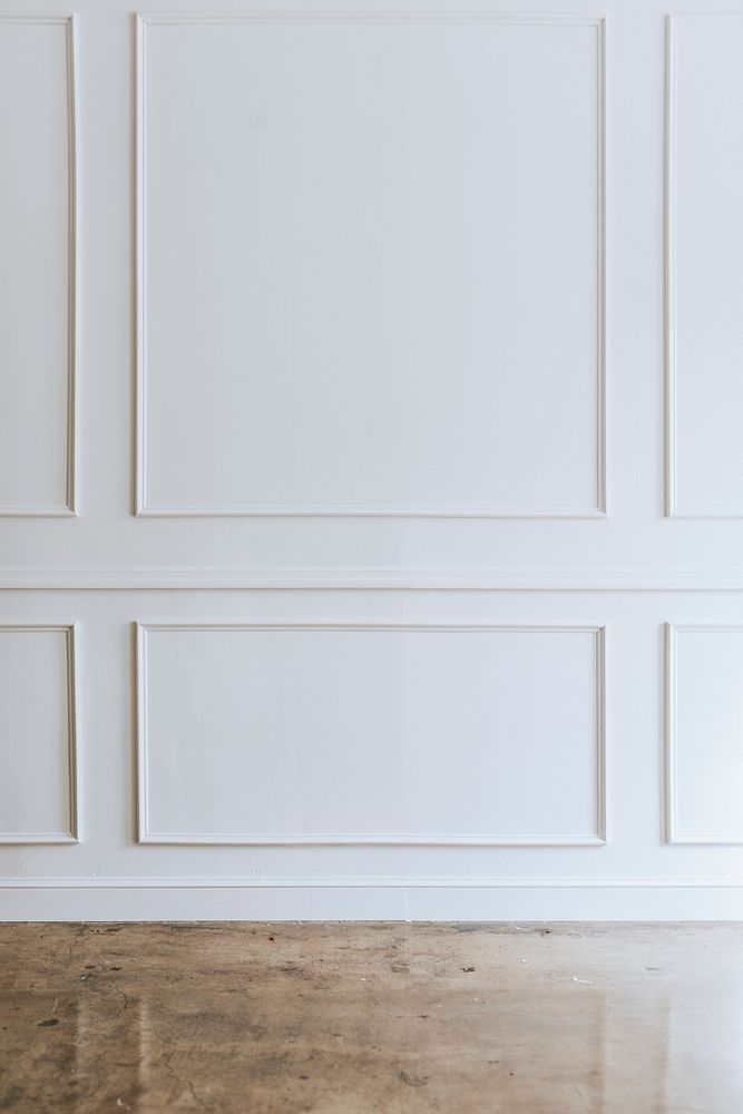 White wall with a brown marble floor