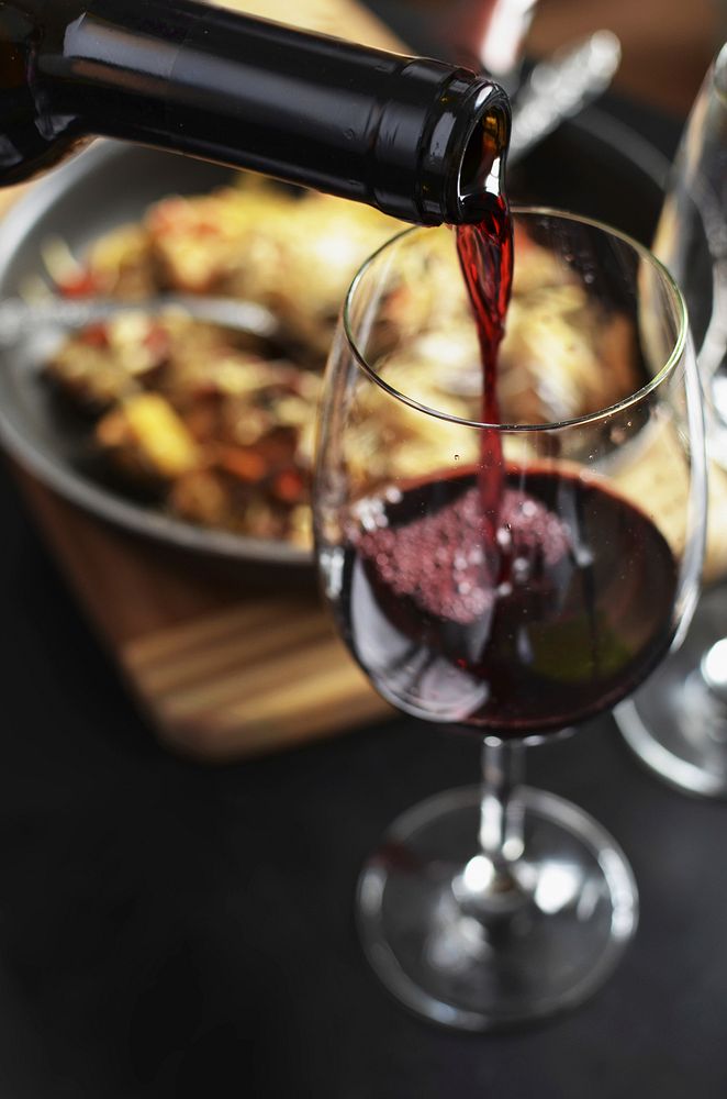 Pouring red wine image, free public domain drink CC0 photo.