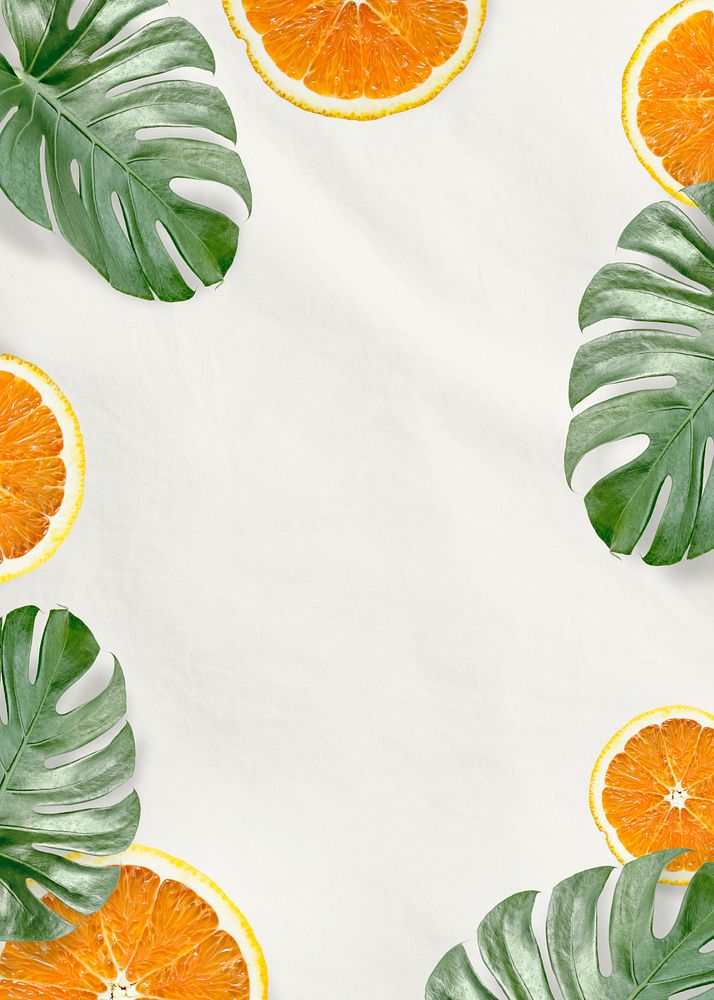 Green Monstera leaves and orange background