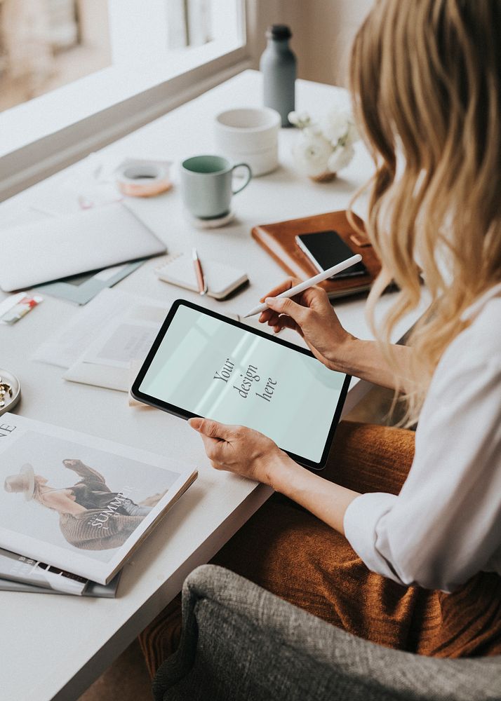 Fashion designer working on a digital tablet mockup