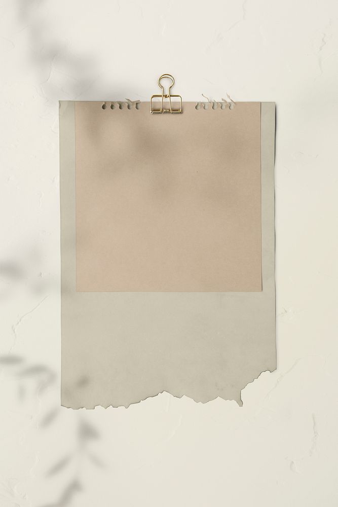 Blank torn pink paper templates set with a paperclip
