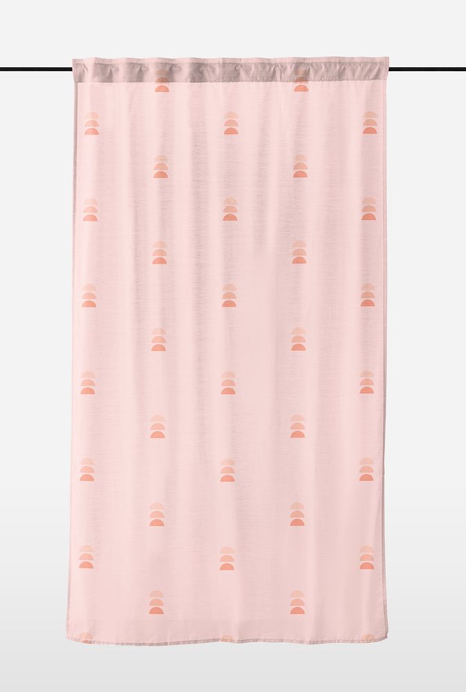 Pink drapery curtain hanging from a curtain rod