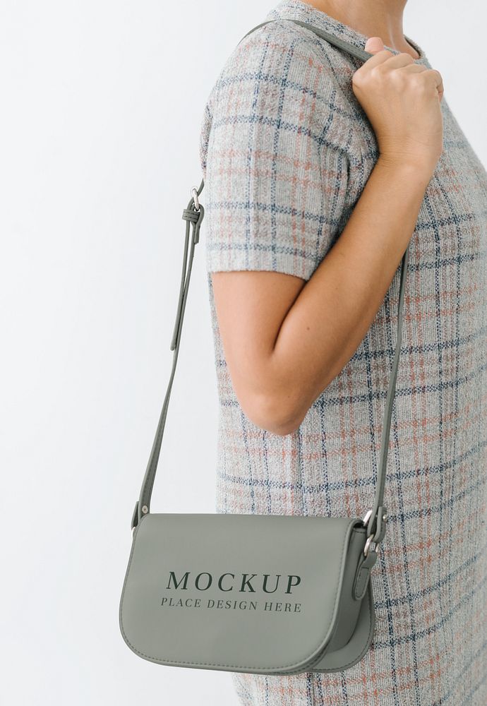 Woman in a gray plaid dress with a gray purse mockup