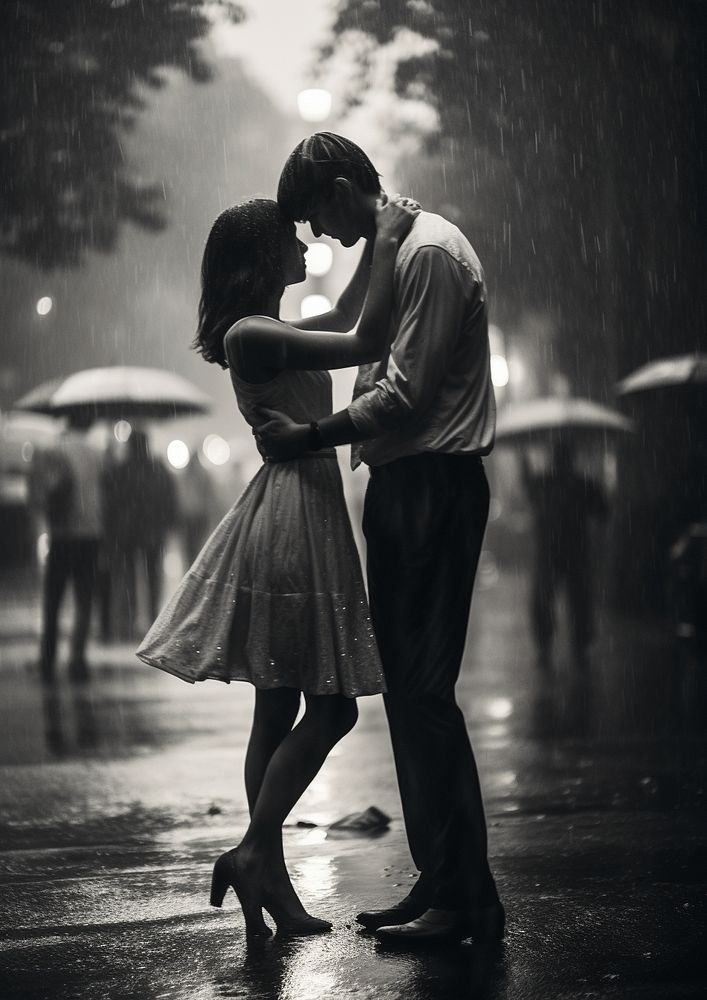 A couple dancing in the rain in the city on the road photography kissing tango. AI generated Image by rawpixel.
